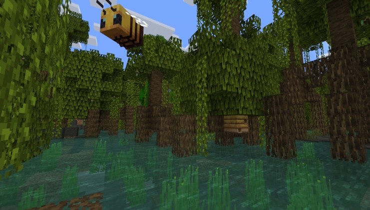 Minecraft mangrove trees over swamp water with a bee flying above