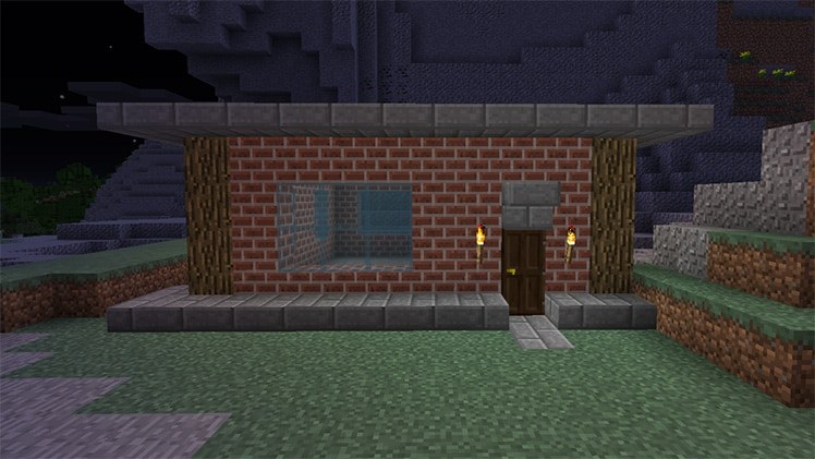 Small Minecraft house with red brick walls, glass window and stone trim
