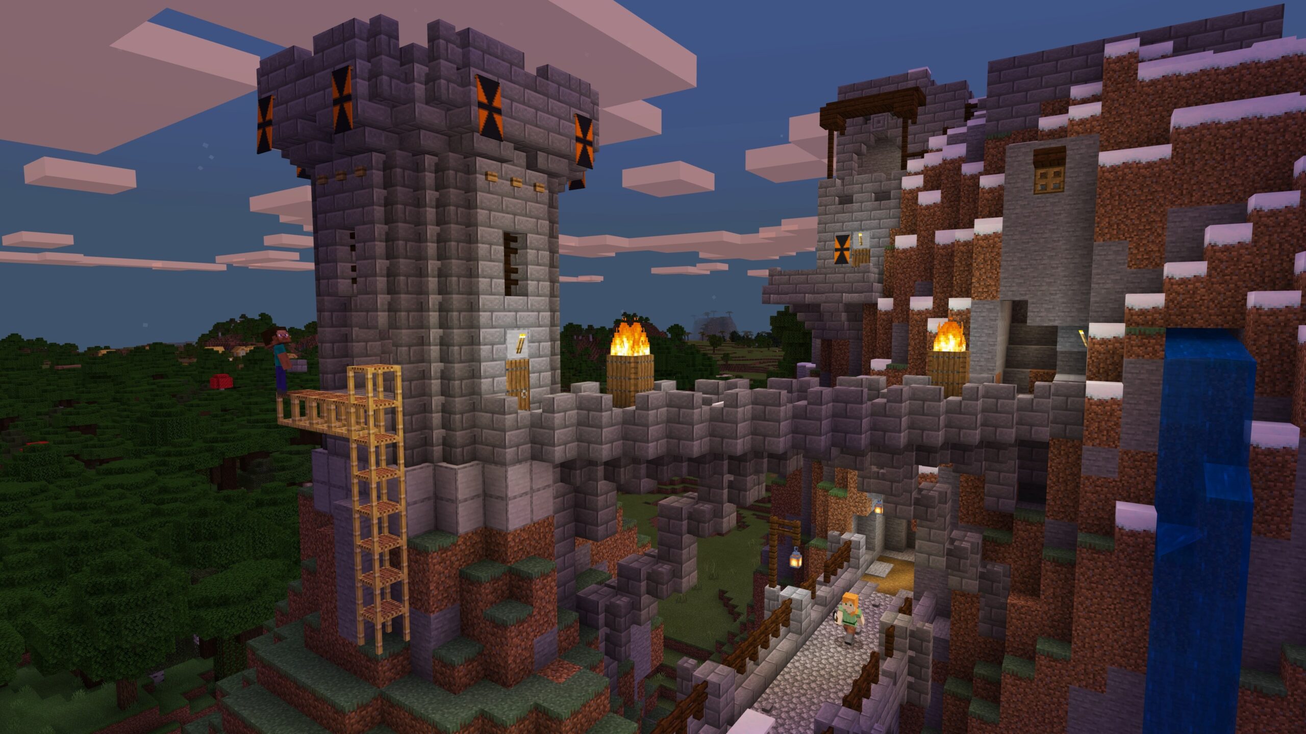 Stone castle towers and a bridge built on a Minecraft mountainside
