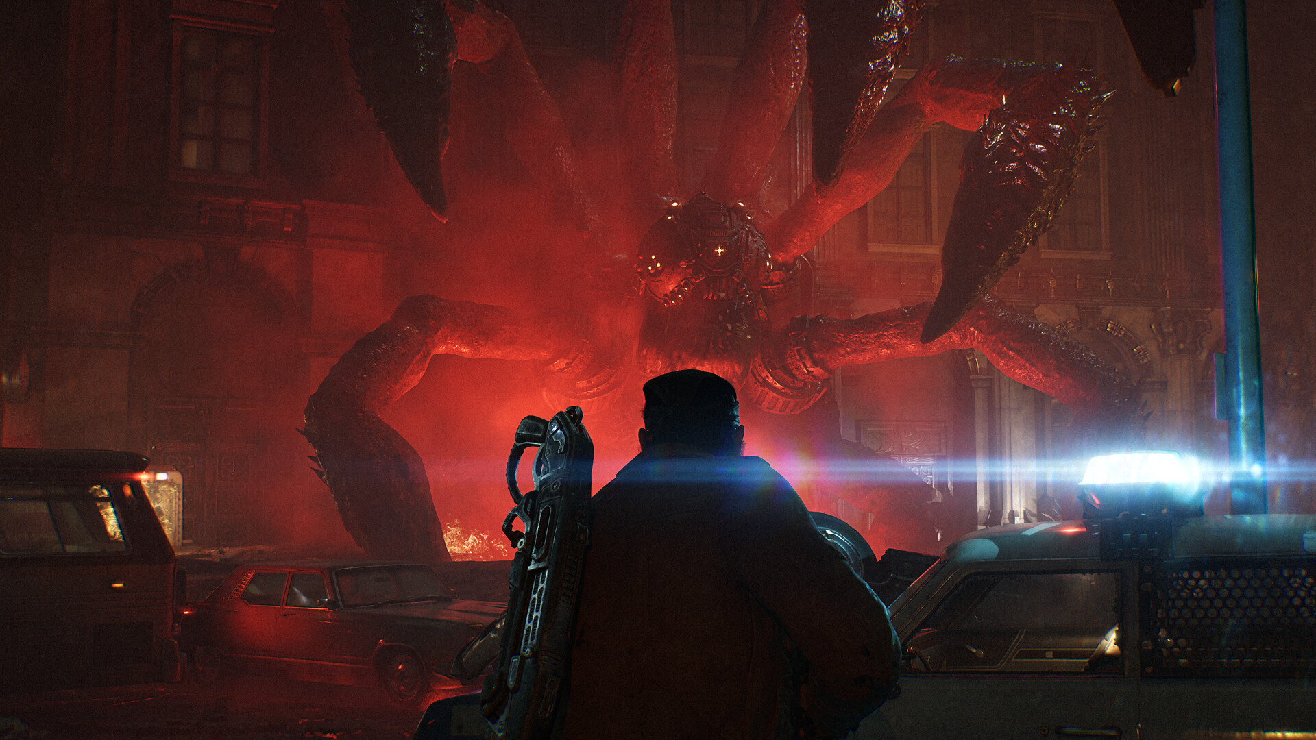 Gears of War: E-Day soldier facing a towering Locust creature in a city street at night